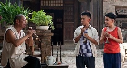 在寂寞中孤独前行 ——运用传统文化符号浅析《百鸟朝凤》中人物形象